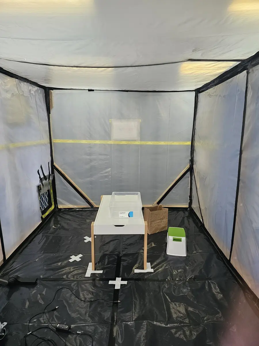 Air monitoring equipment on stands inside the asbestos enclosure