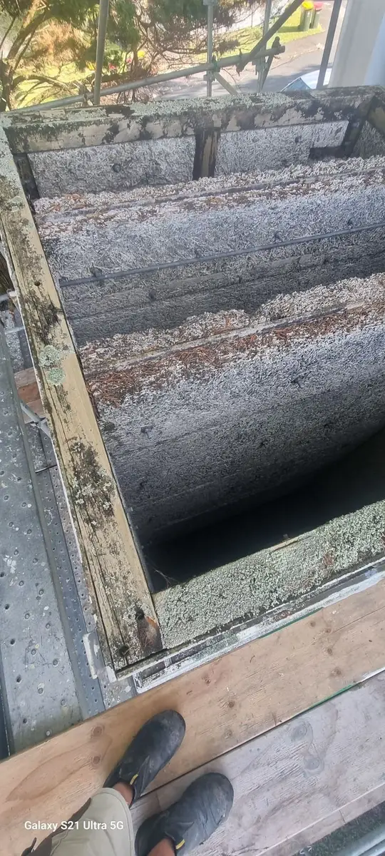 Interior of the asbestos-cement duct with cladding sheets and timber framing