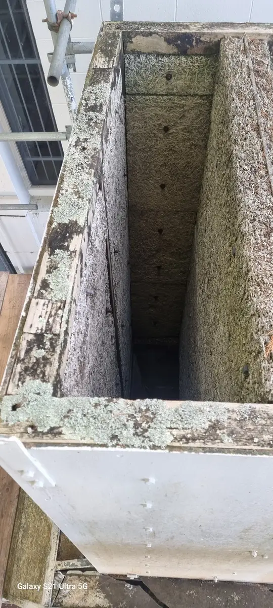 Looking down inside the asbestos-cement duct, showing the fibre-cement lining