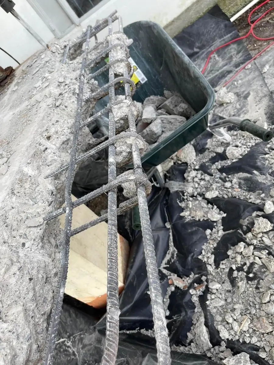 Asbestos-cement rubble on poly sheeting during the controlled removal