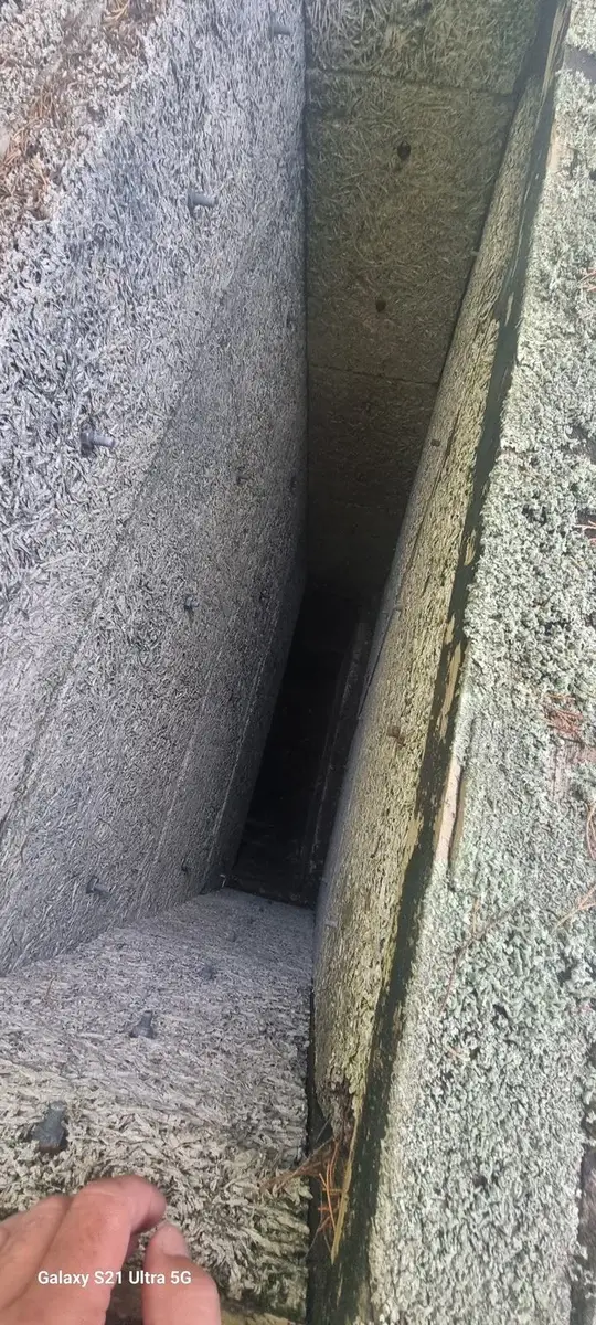 Close-up of the interior surface of an asbestos-cement sheet inside the duct