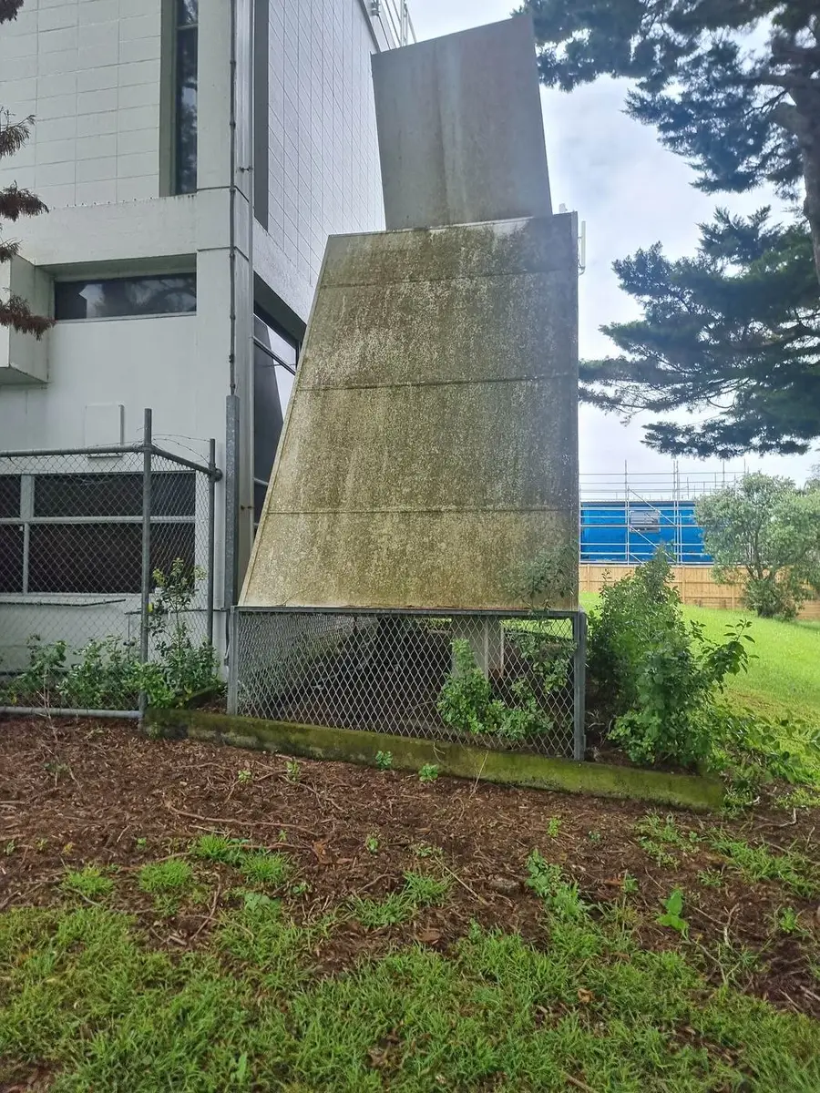 Exterior of the asbestos-cement ventilation structure on a commercial building in Auckland