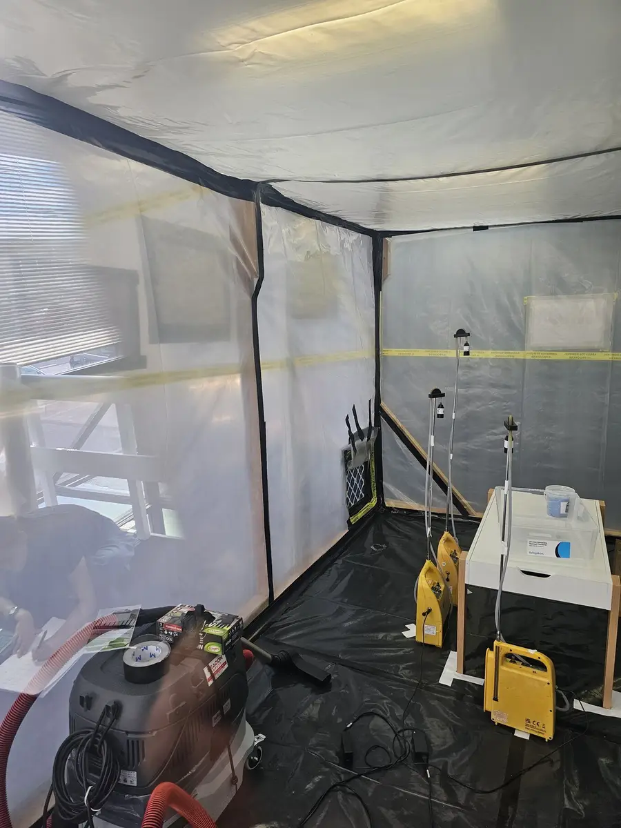 Close view of the air monitoring set-up inside the asbestos enclosure