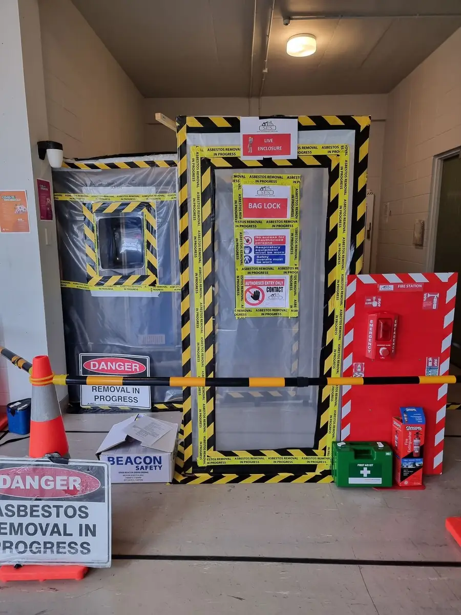 Enclosure entry with danger asbestos signage