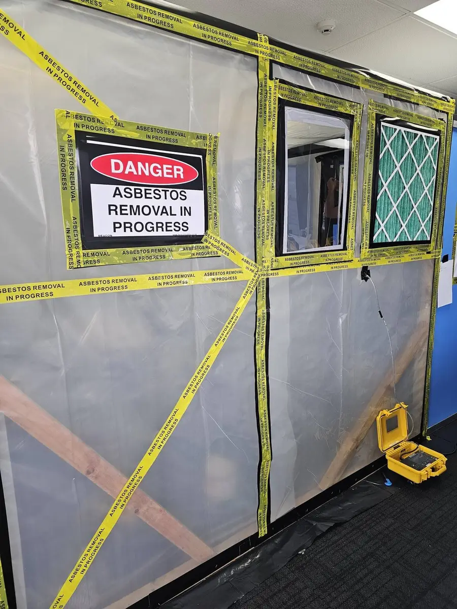 HEPA filter panel and danger signage on the asbestos enclosure