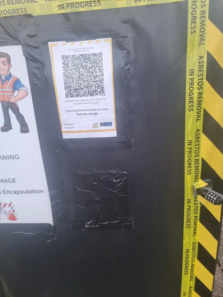 QR code sign on the enclosure at the residential asbestos removal