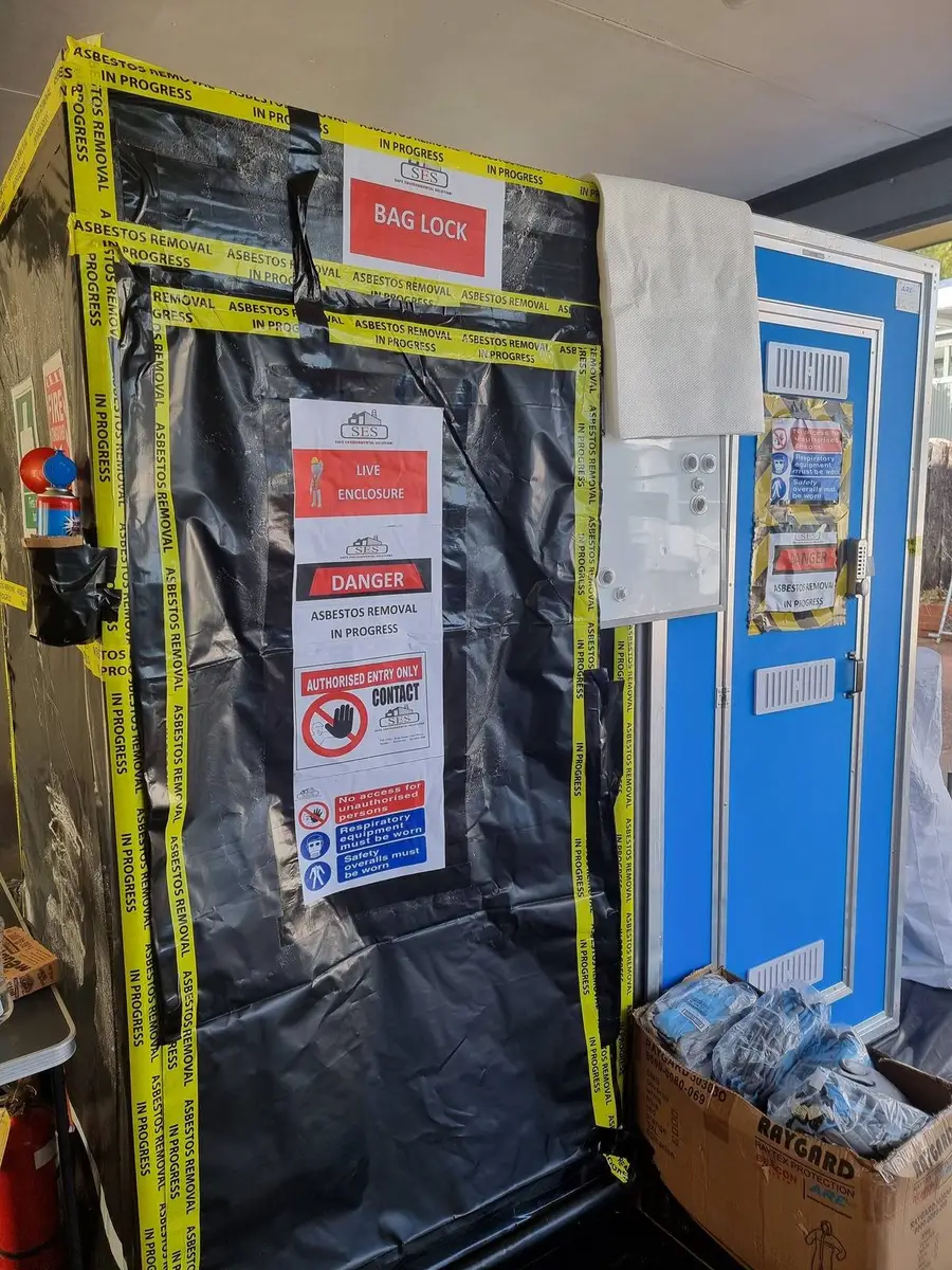 Bag lock on the black poly enclosure with danger signage