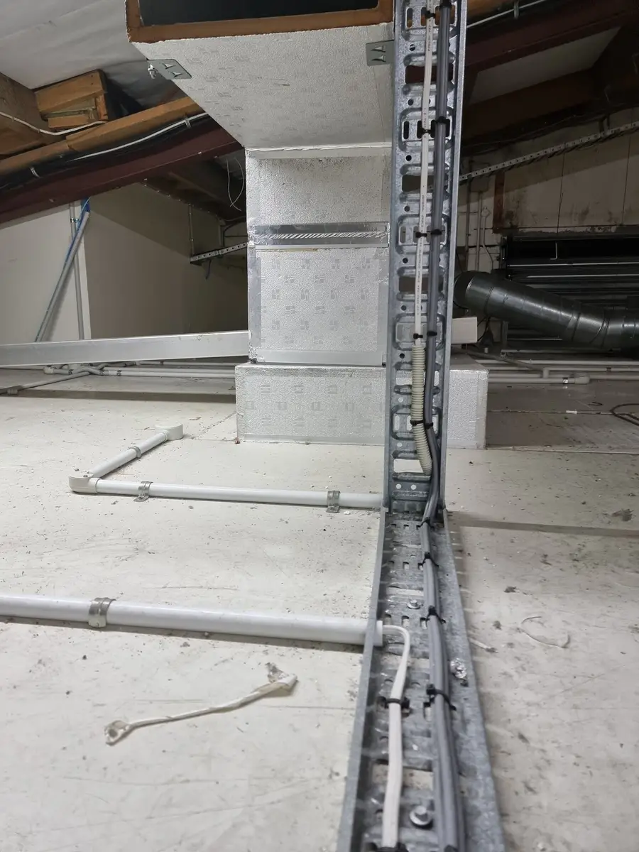 Ducts and services in the ceiling void during asbestos dust removal