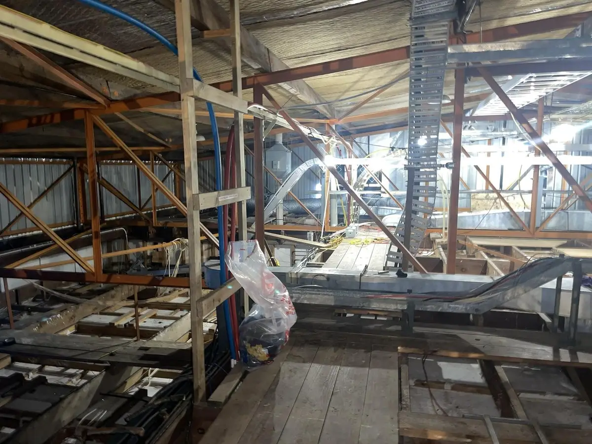 Ductwork and beams in the ceiling void during asbestos removal