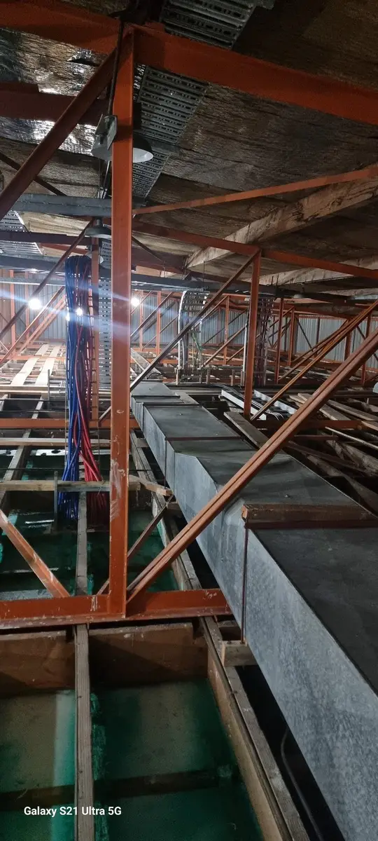 Building services in the ceiling void during commercial asbestos removal in Auckland