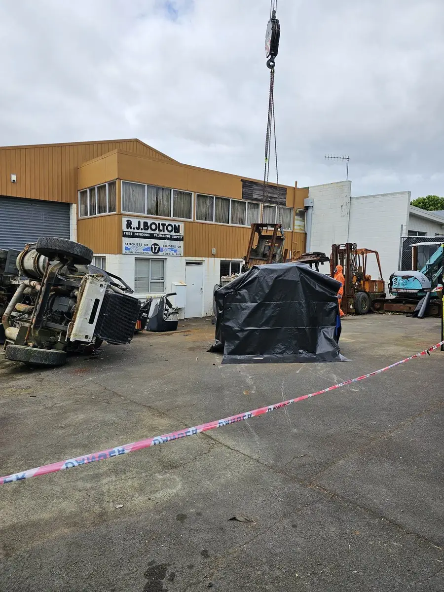 Contaminated plant beside a lined skip bin ready for the crane