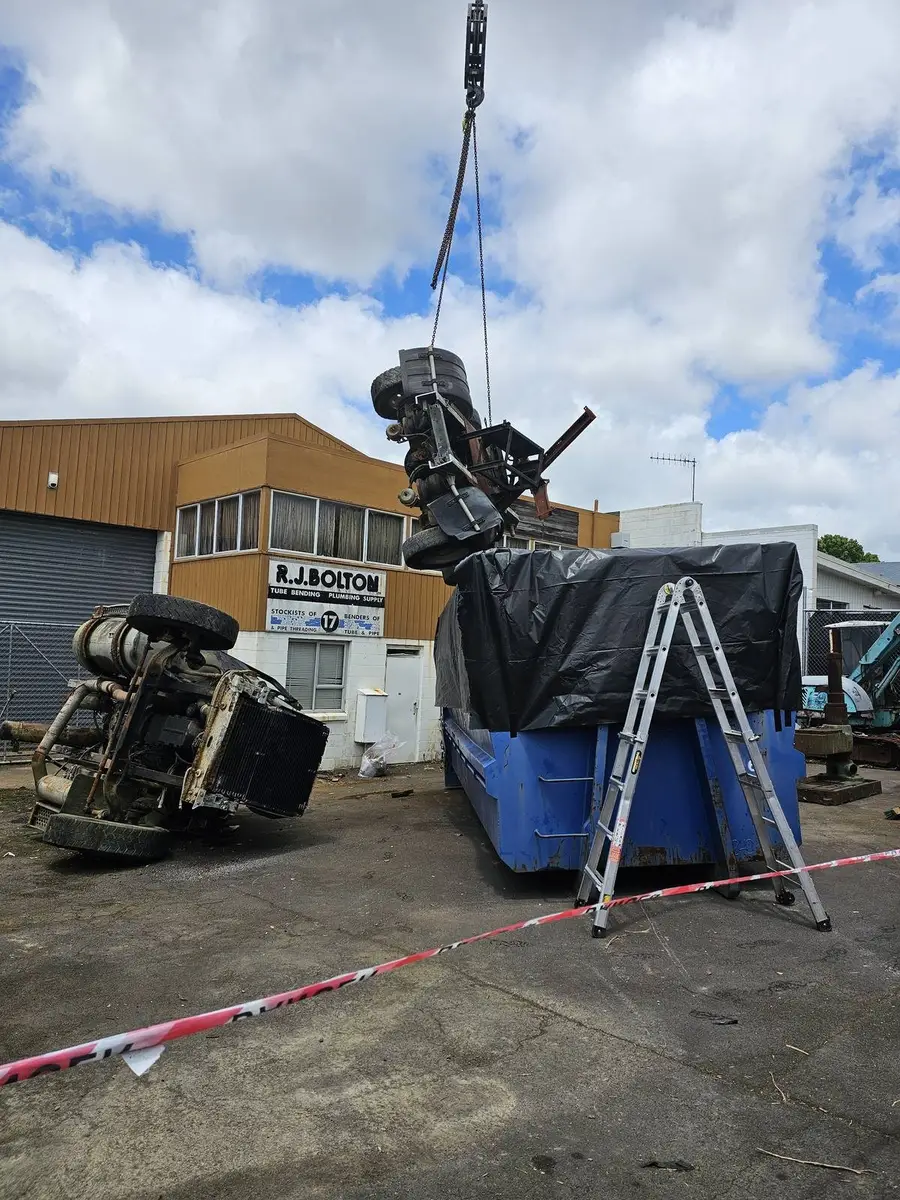 Contaminated plant lowered into the lined bin by crane