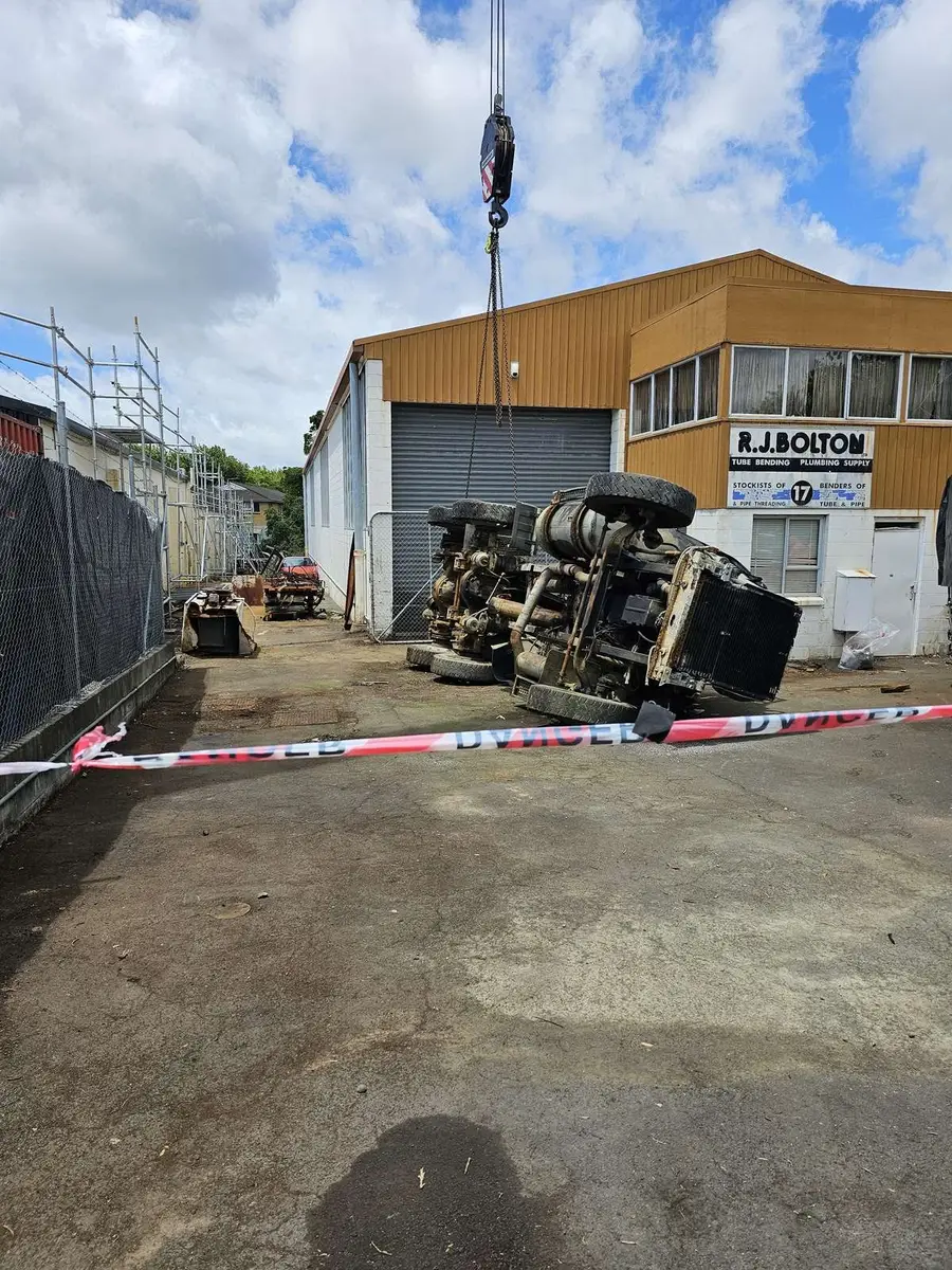 Crane hook over the contaminated plant inside the exclusion tape