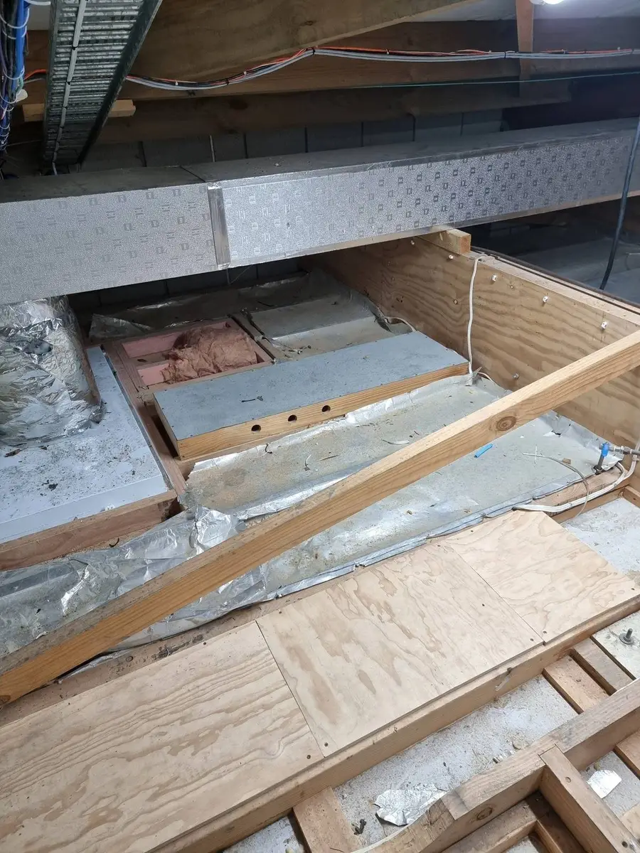 Debris on ceiling tiles before the asbestos void clean