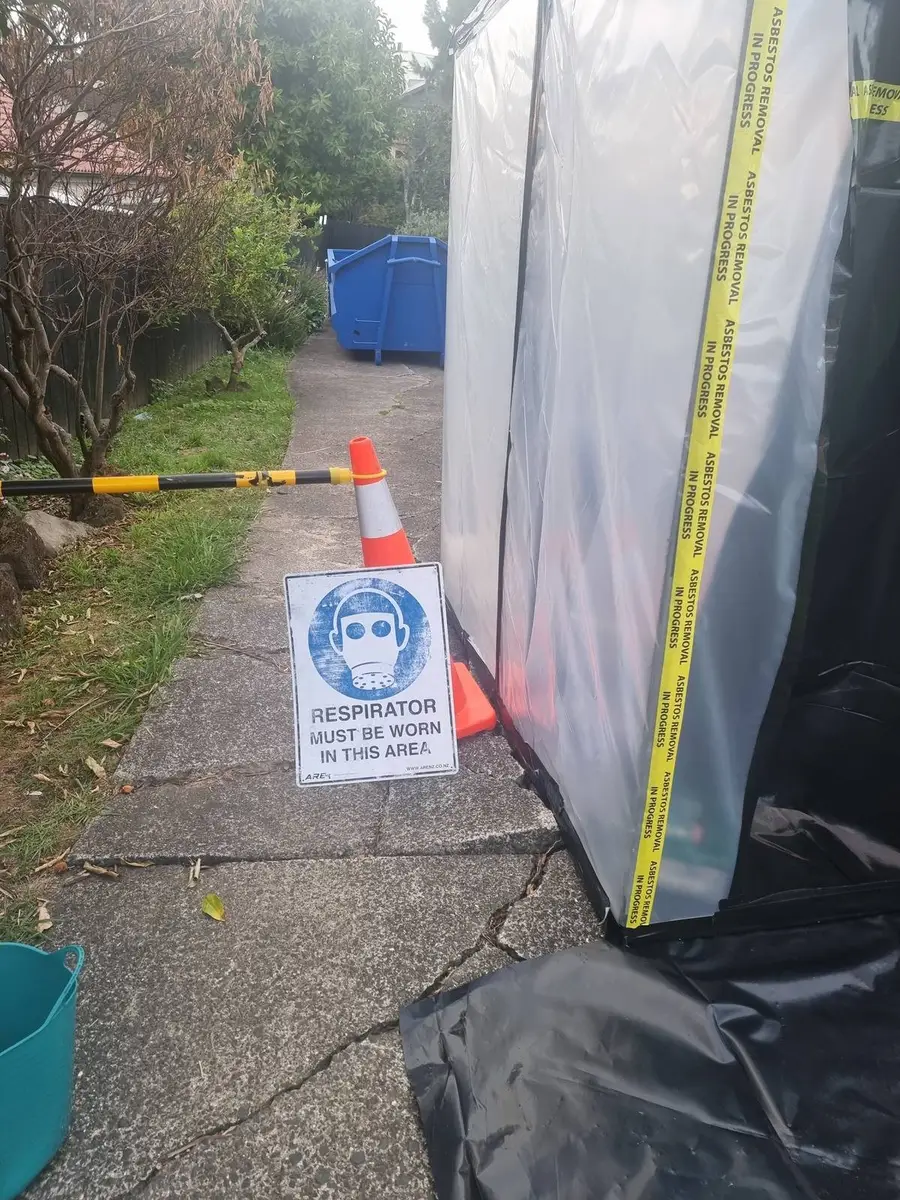 Decontamination unit on the path with respirator sign