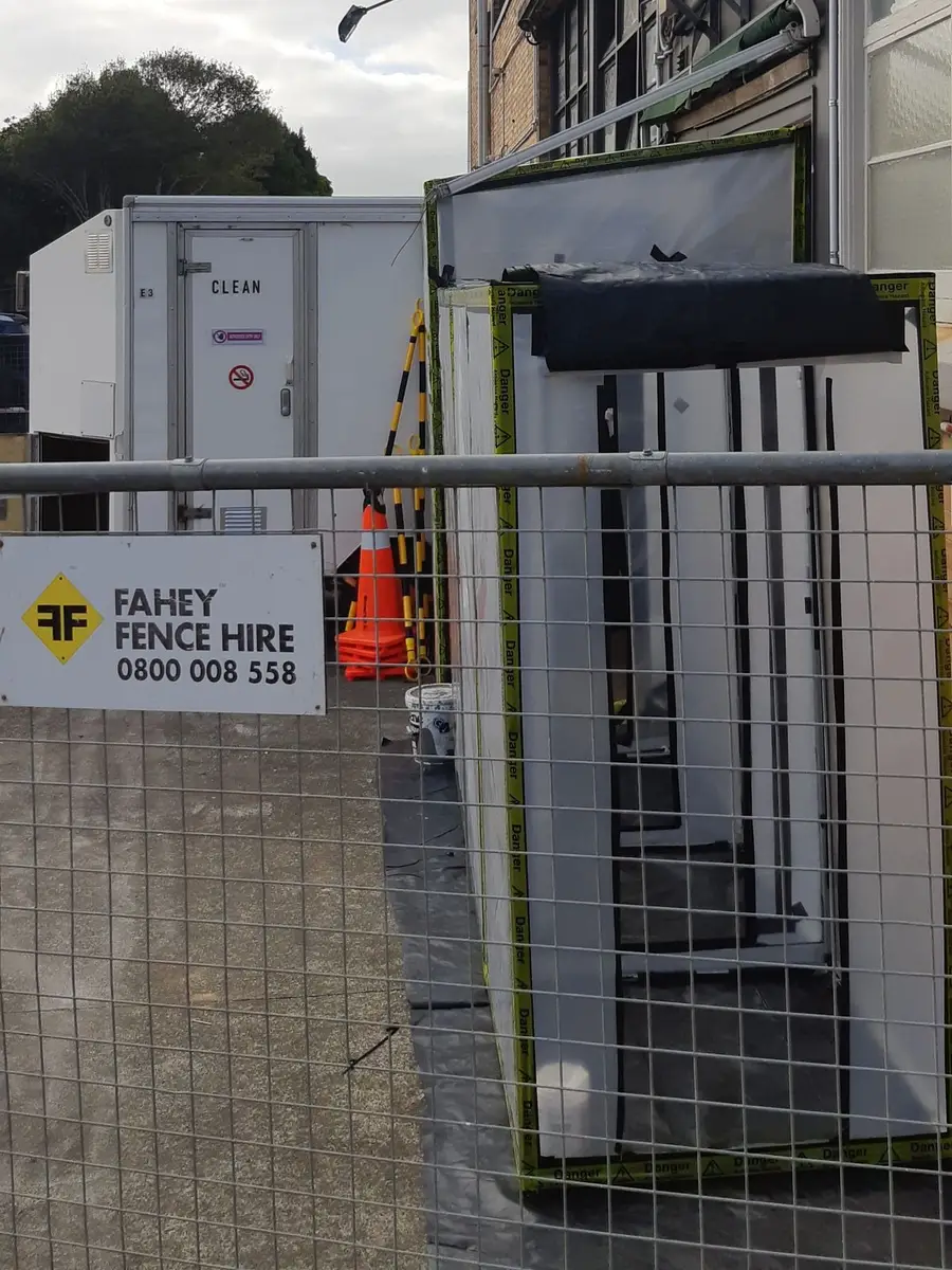 Decontamination trailer in a fenced compound at a commercial site