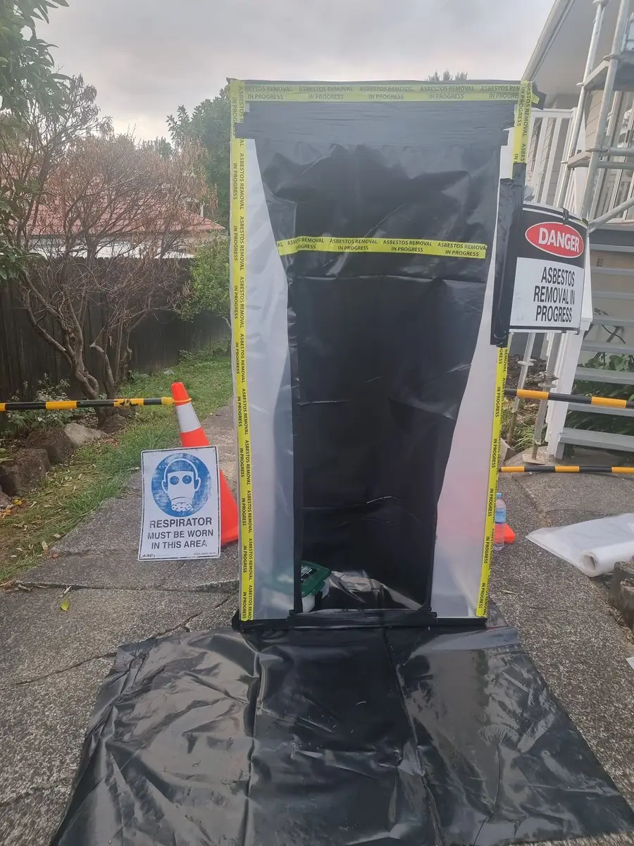 Decontamination unit doorway with danger sign at the house