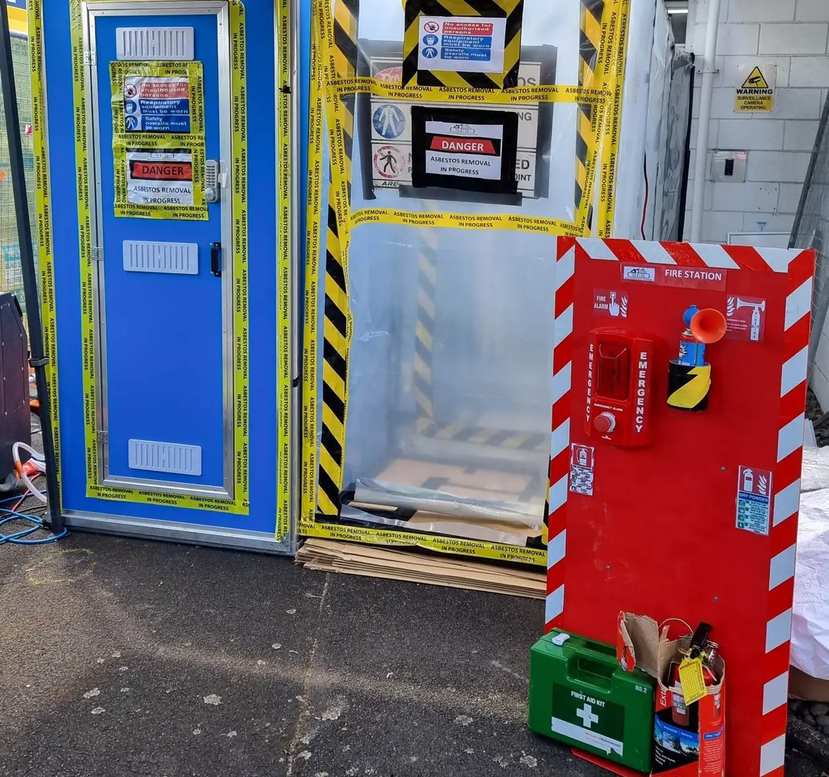 Decontamination unit and fire station in a commercial car park
