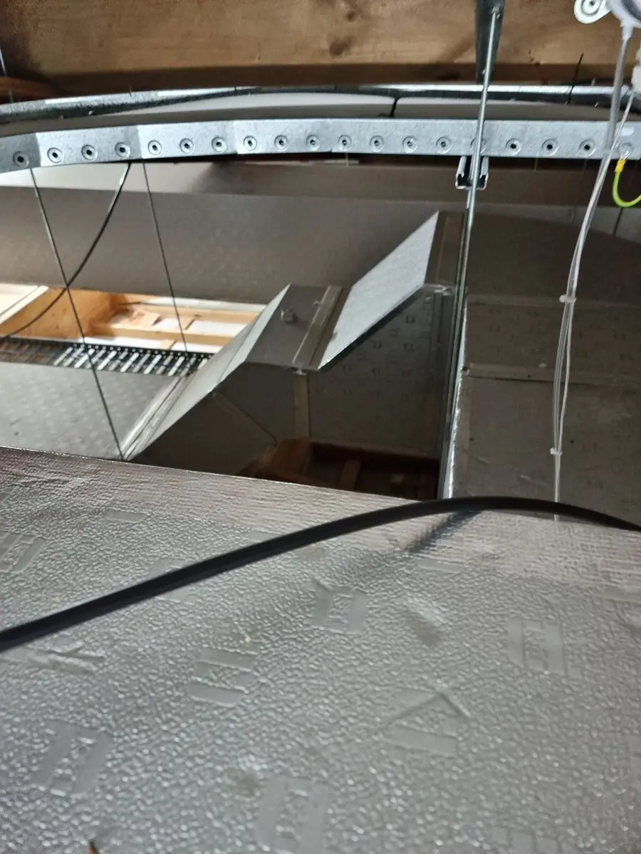 Duct surface coated in asbestos-contaminated dust
