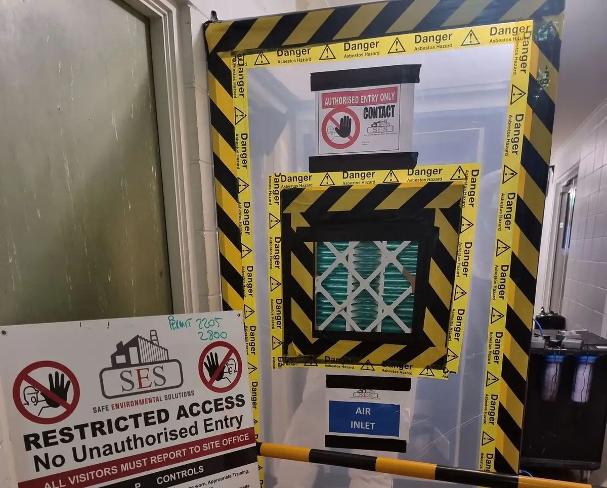Air inlet filter panel on the enclosure framed in danger tape