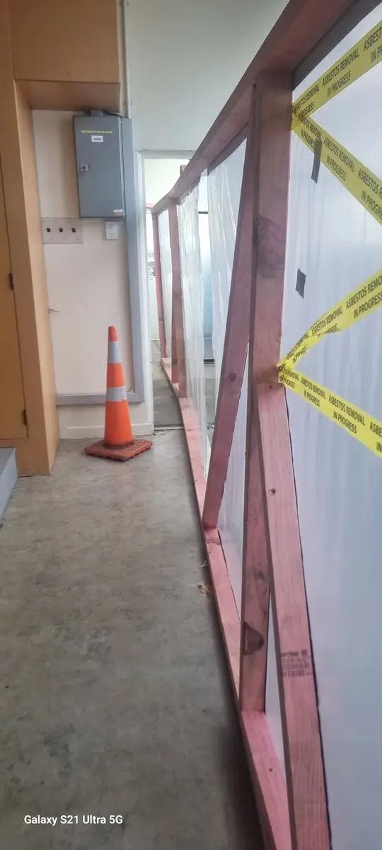 Enclosure framing in the corridor during office asbestos removal