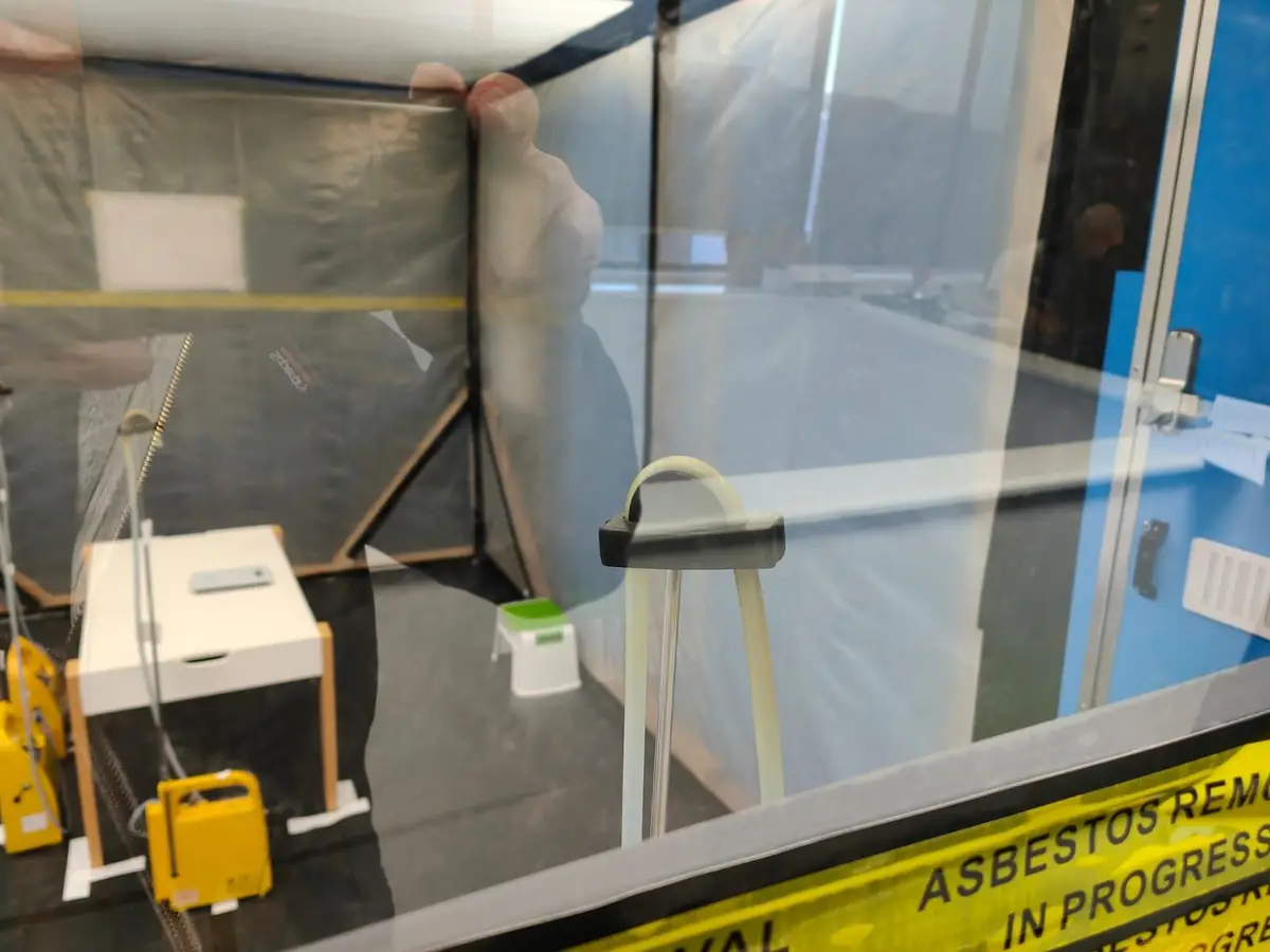 Viewing window with air monitoring equipment inside the commercial enclosure