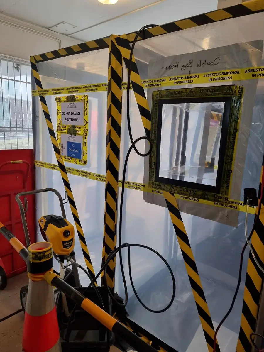 Viewing window in the asbestos enclosure wall