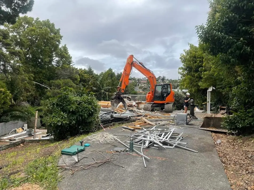Excavator with steel sorted for recycling at the demolition site