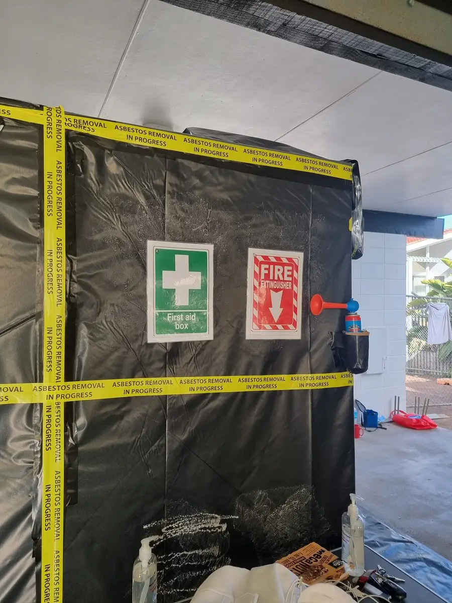 First aid and fire signs on the black poly enclosure