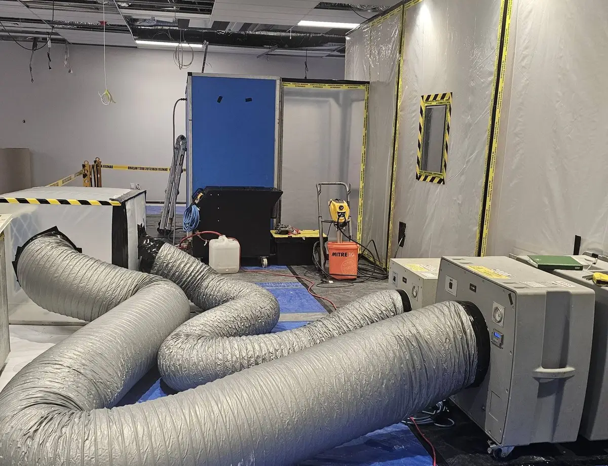 Flexible ducting and negative air units at the office asbestos removal