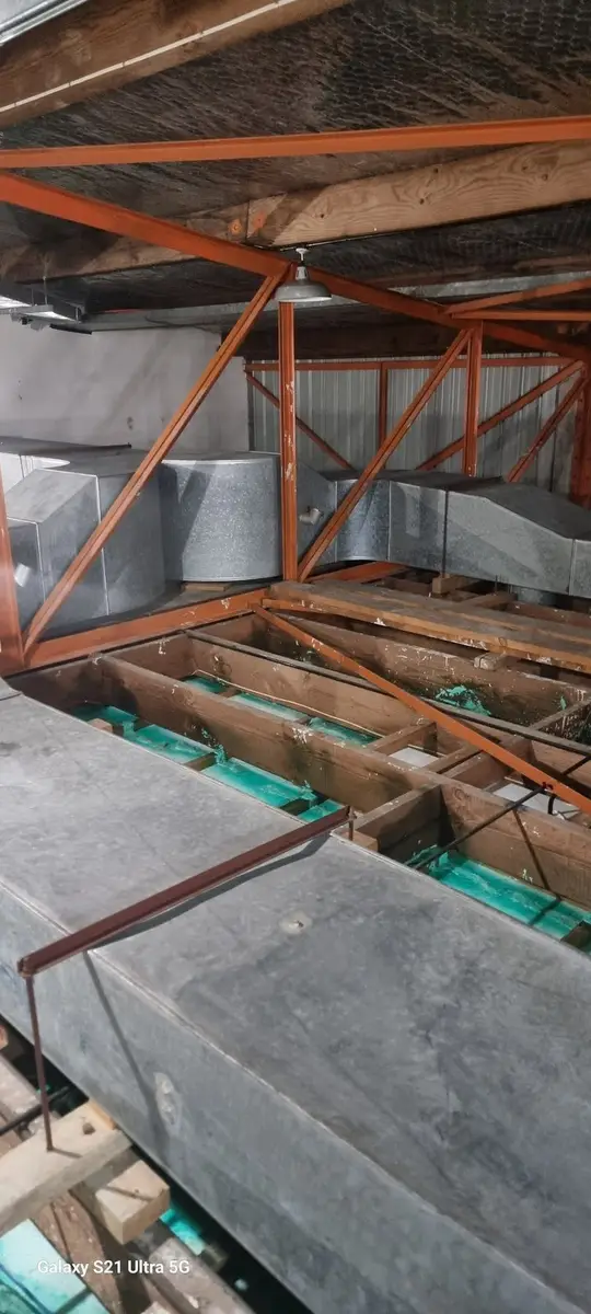 Galvanised ductwork in the ceiling void during asbestos removal