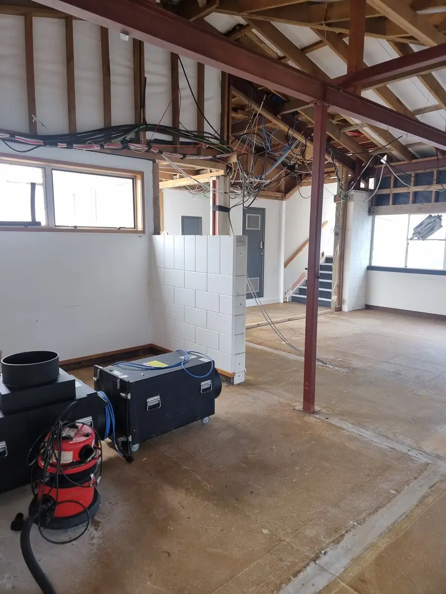 HEPA vacuum and negative air unit at the completed office strip-out