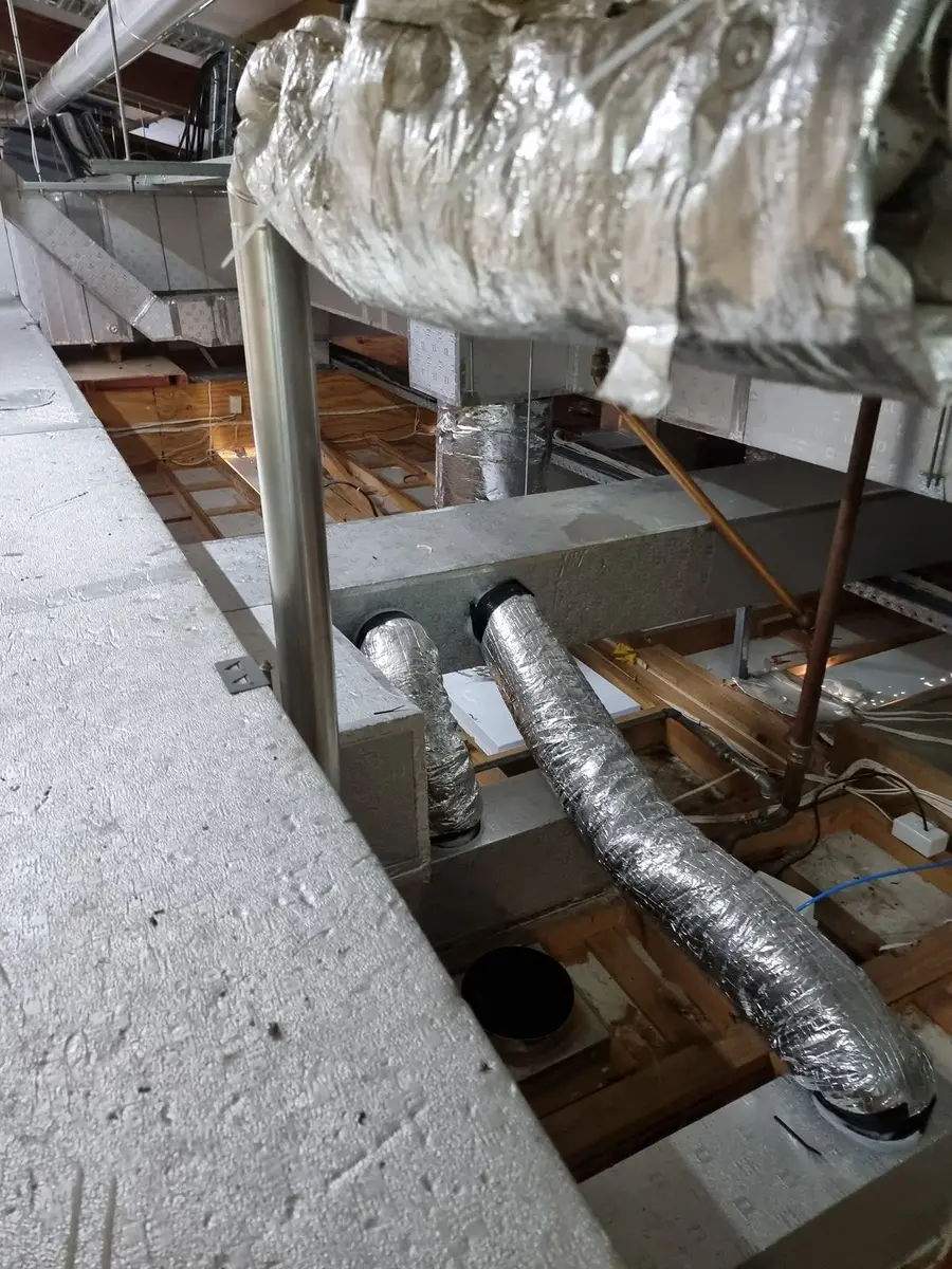 Lagged duct in the ceiling void with asbestos insulation