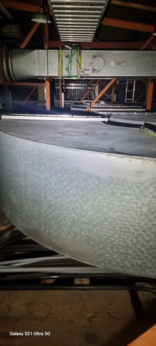 Lagged duct in the ceiling void before removal