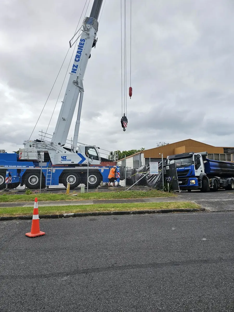 Mobile crane set up in an industrial yard for the contaminated plant lift