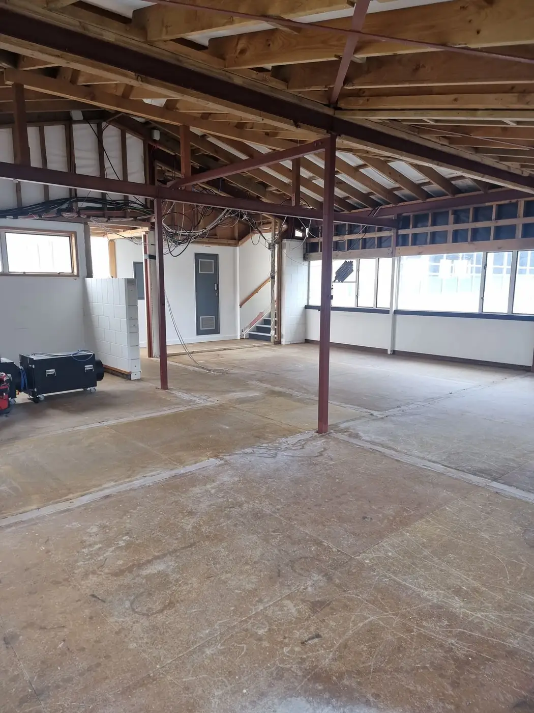 Concrete floor swept clean after the office soft-strip
