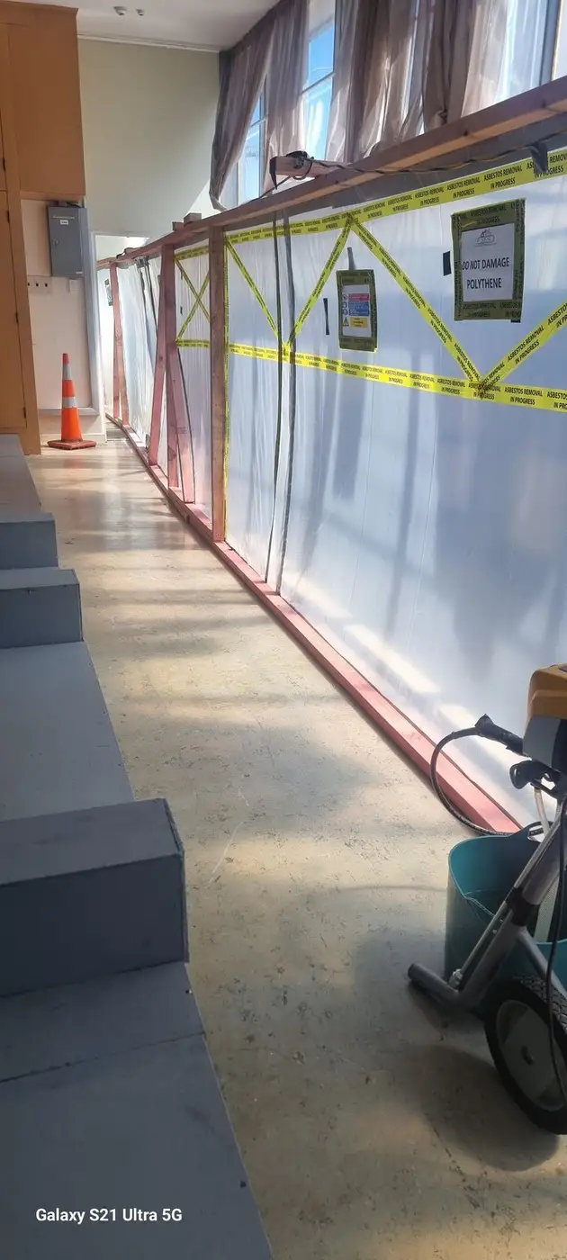 Completed asbestos enclosure along the office corridor
