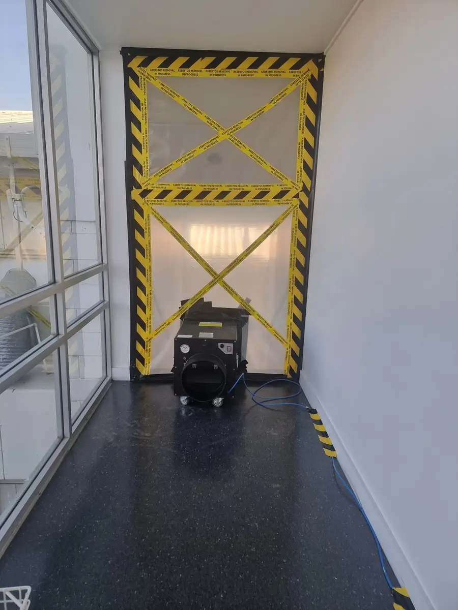 Office corridor enclosure doorway with danger tape