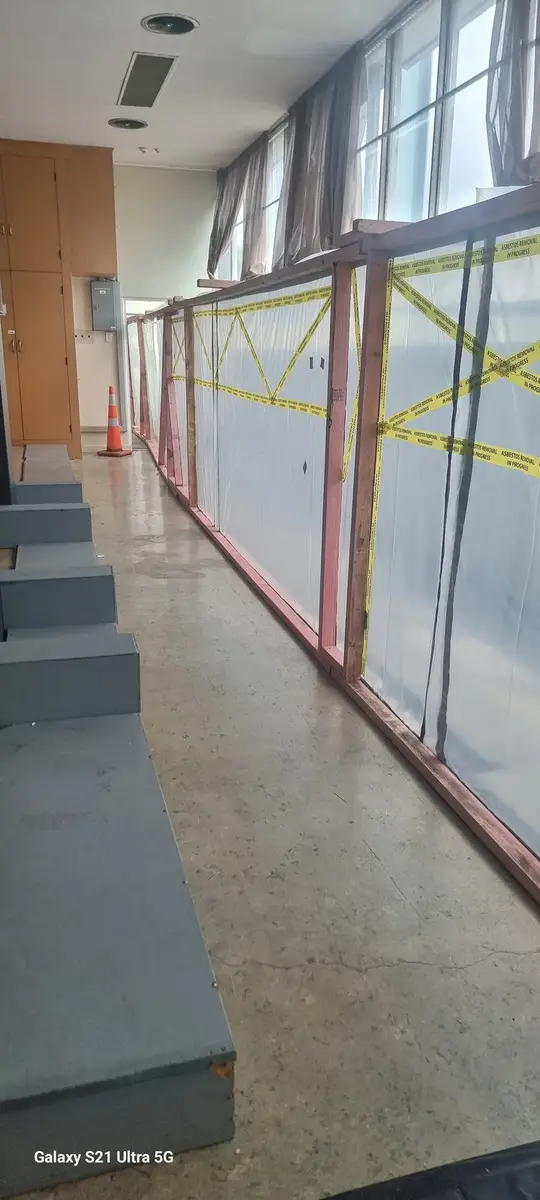 Enclosure sheeting along the office corridor windows
