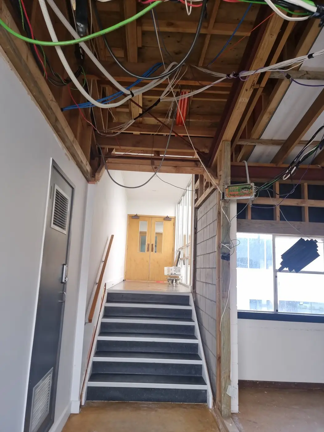 Office stairwell and doors after the soft-strip