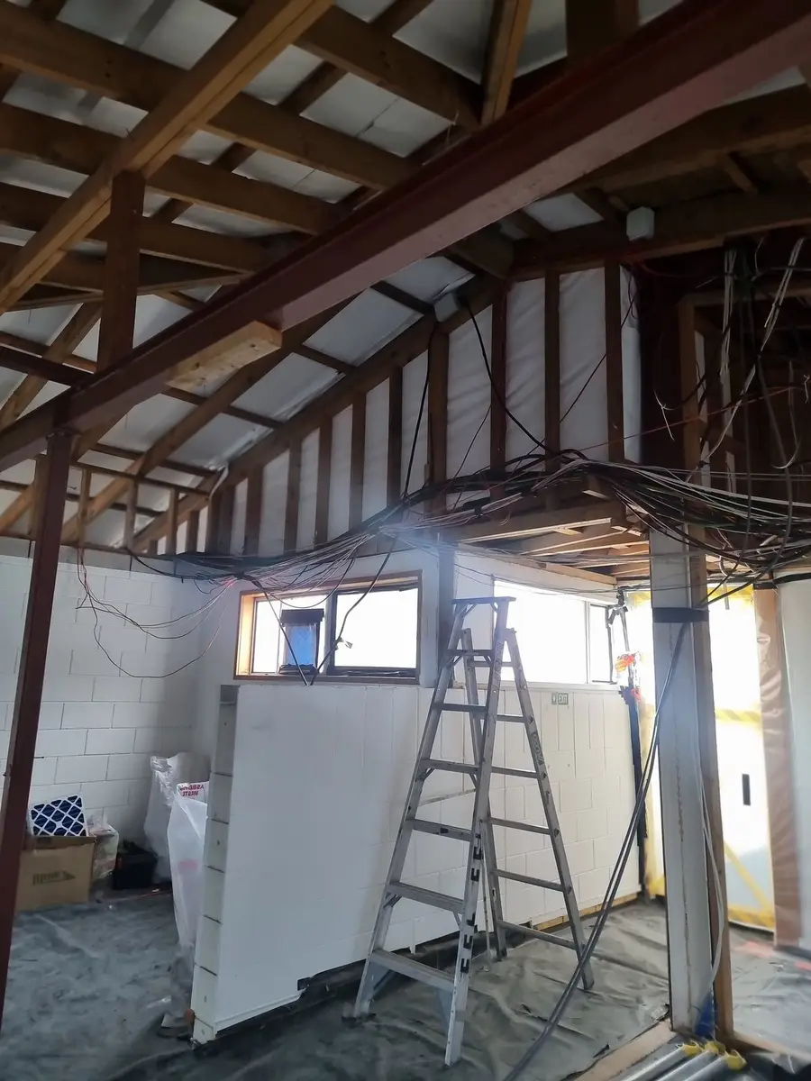 Office ceiling framing with services removed during the strip-out