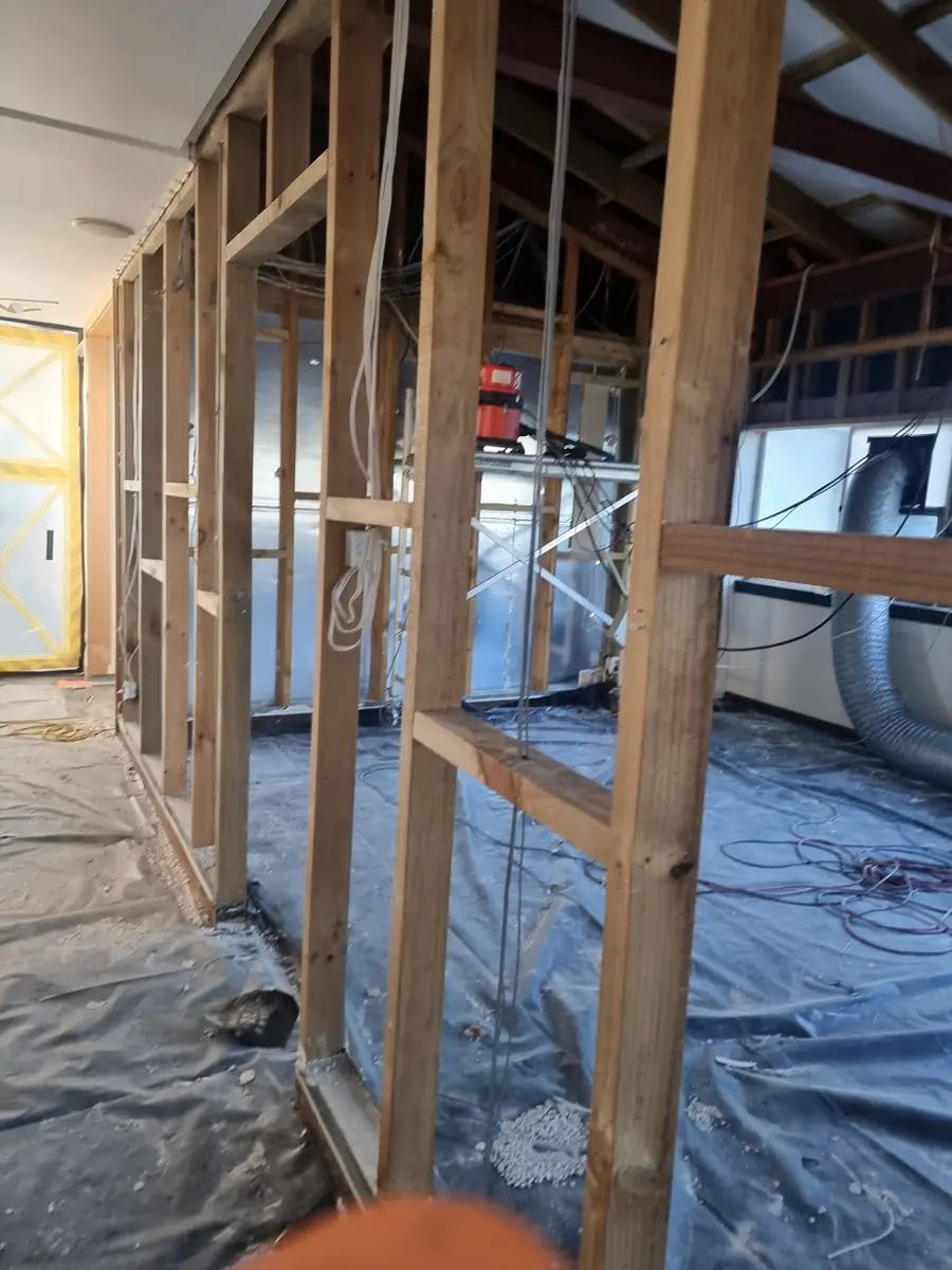 Timber framing exposed during the office strip-out and asbestos removal