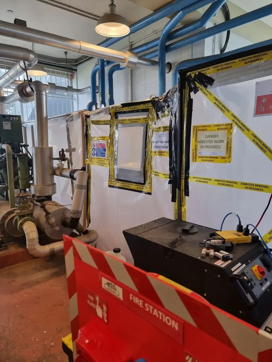 Plant room with decontamination unit and fire station beside pipework