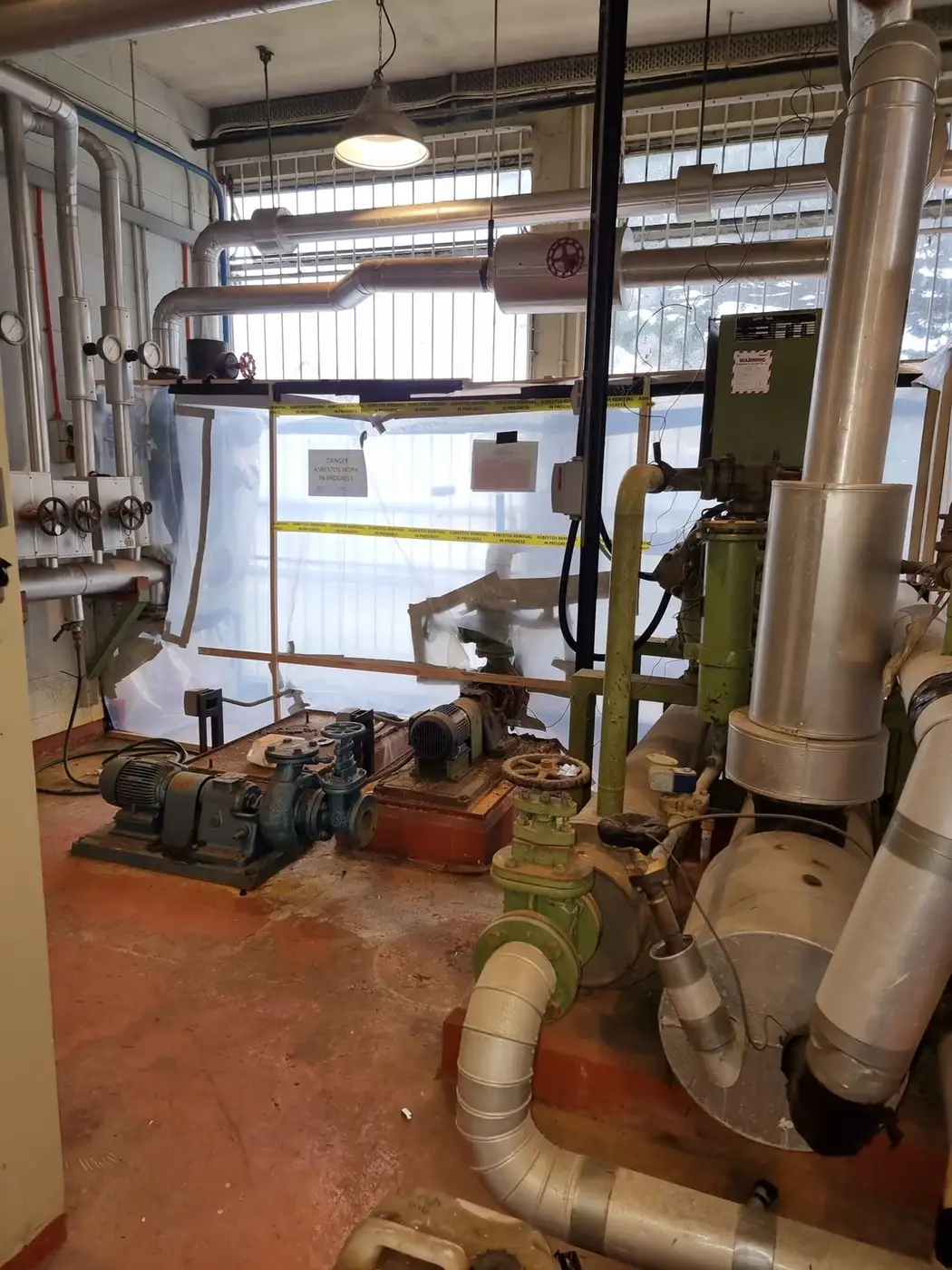 Plant room pipework before asbestos lagging removal