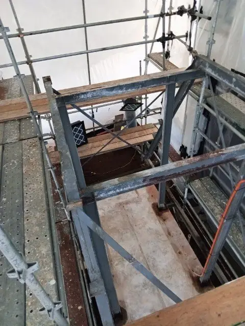 Timber platform and scaffold inside the enclosure during the asbestos removal works