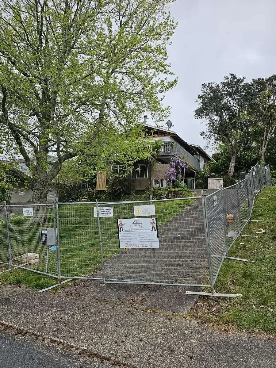 Security fence and SES hoarding at the residential demolition site