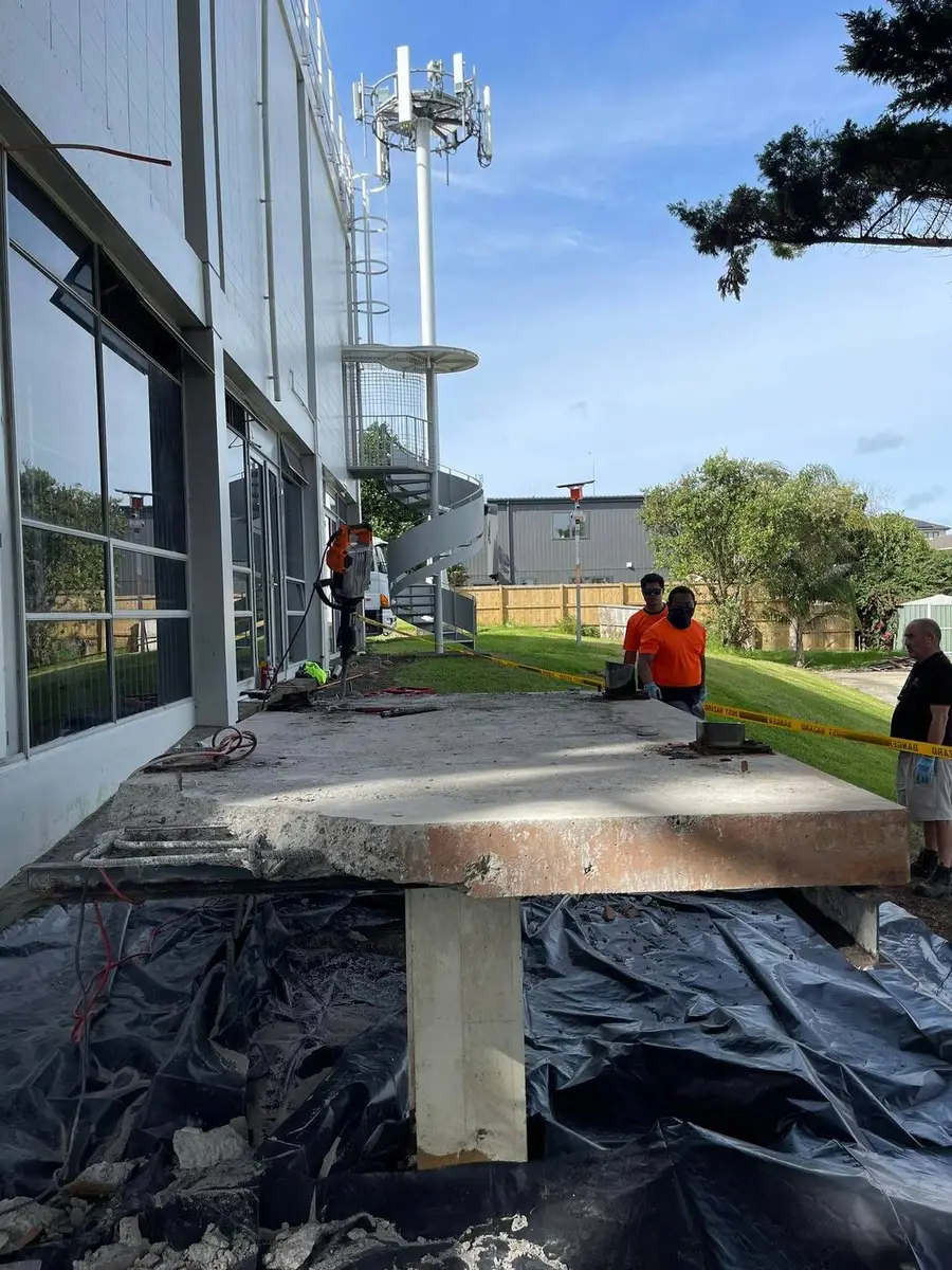 SES crew at ground level with the structure removed and the site being cleared