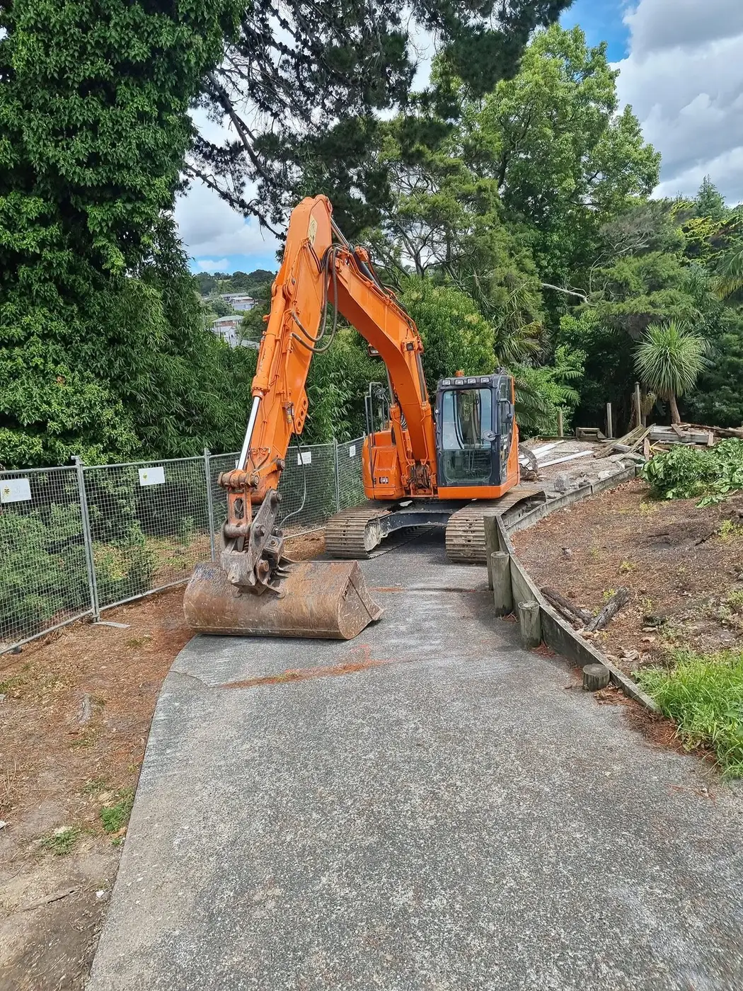 SES excavator on the driveway at the sub-division demolition