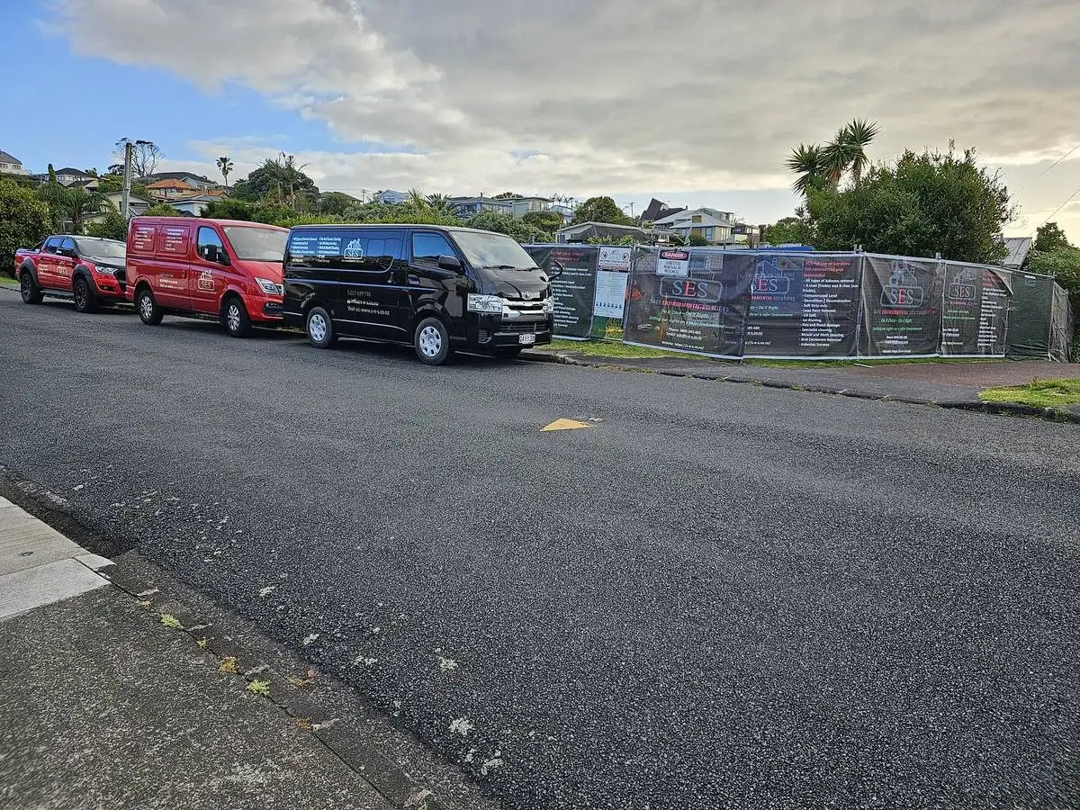 SES fleet lined up along the site hoarding