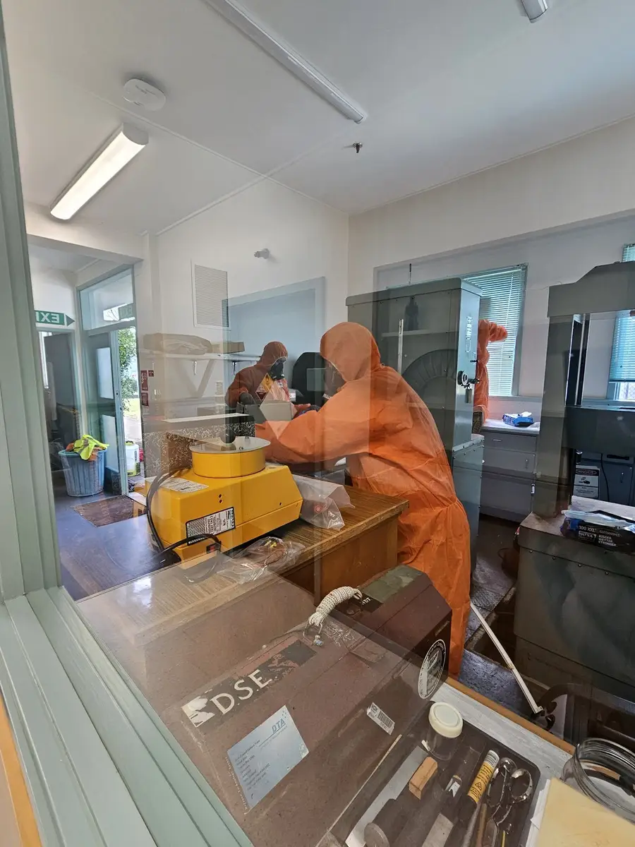 SES operative in PPE and respirator in the office